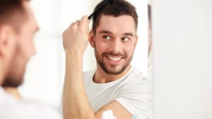 Man Brushing Hair